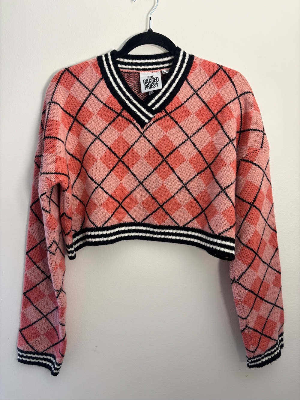 The Ragged Priest Pink Argyle Cropped V-Neck Sweater with Black Trim
